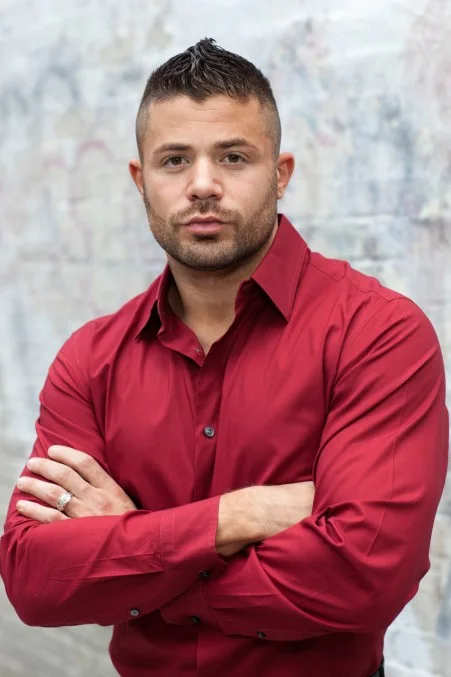 Portrait of Jeffrey Wachman in a red shirt
